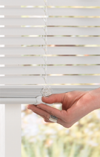 image showing a hand easily lifting/tilting a white cordless vinyl mini blind