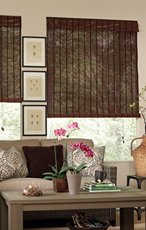 Vignette showing fruitwood matchstick rollup (indoor/outdoor) shades in a three-season patio